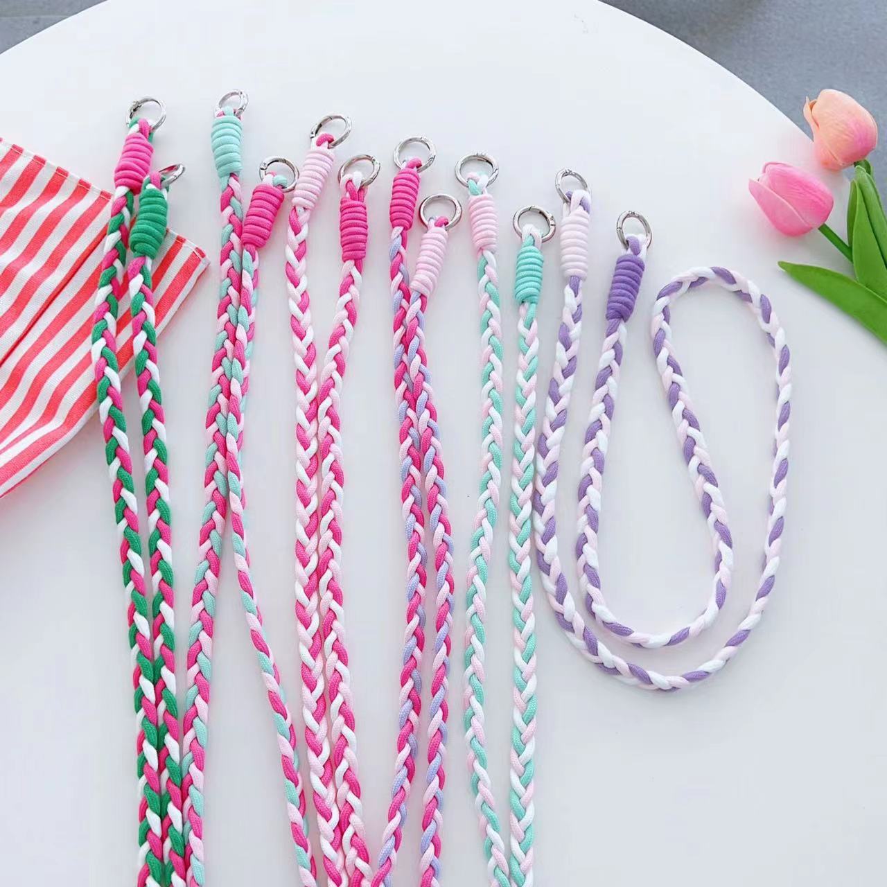 Assorted colors of woven rope phone straps - including Pink, Green, Black, Blue, Purple, and more