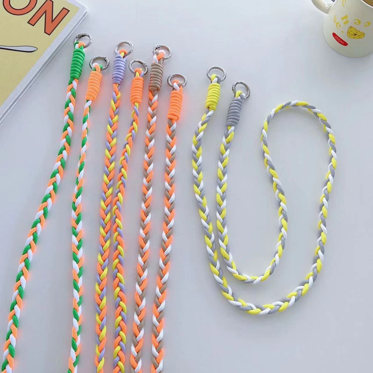 Assorted colors of woven rope phone straps - including Pink, Yellow, Blue, Purple, and more