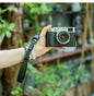 Black SLR camera wrist strap in cotton cloth and leather - compact design